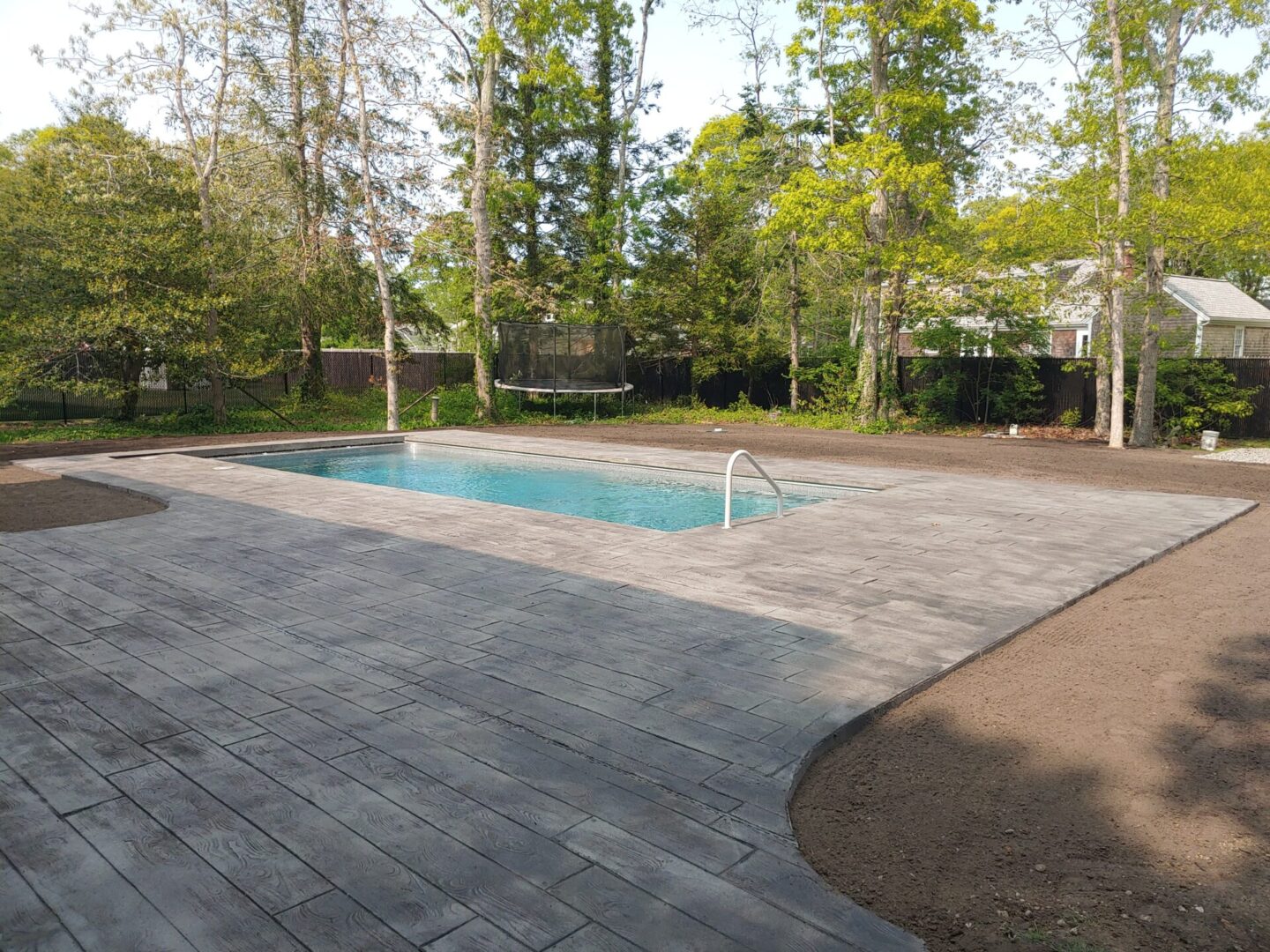 A pool that is in the middle of some trees