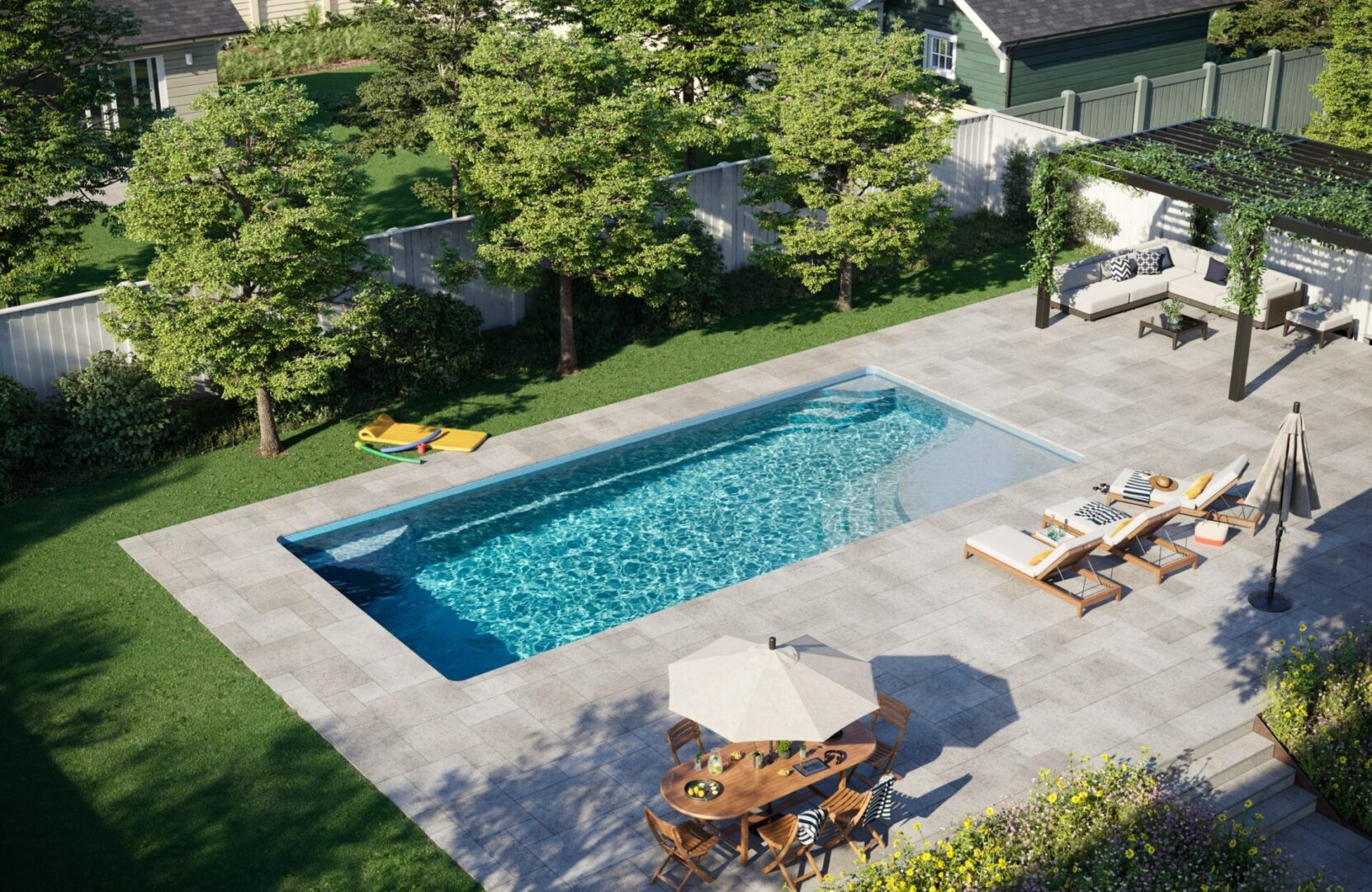 A swimming pool with an umbrella and chairs in the middle of it.